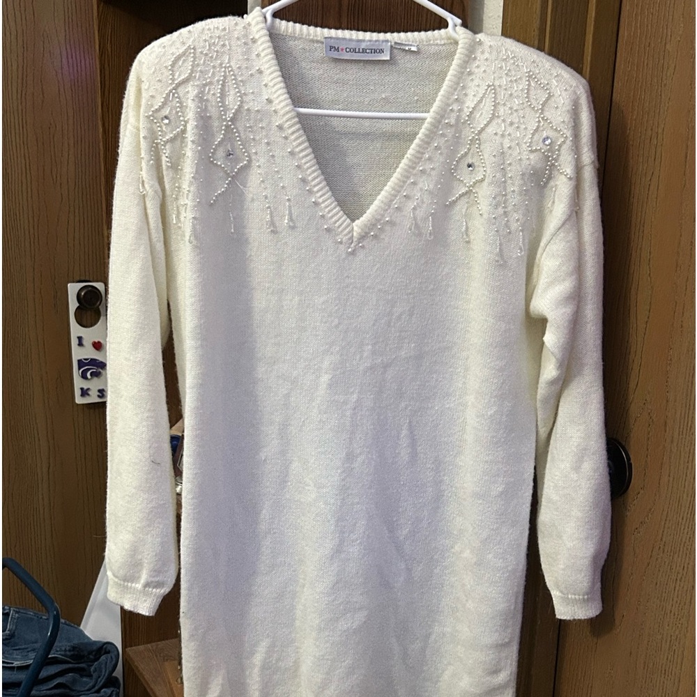 Women’s vintage sweater dress. White in color. Never worn.